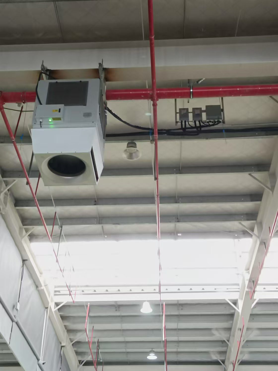 heating a machining hall with CNC equipment using ceiling-mounted OXA units