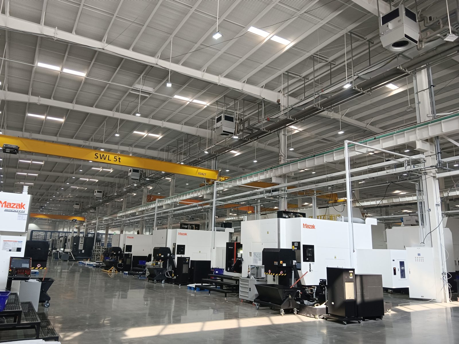 heating a machining hall with CNC equipment using ceiling-mounted OXA units