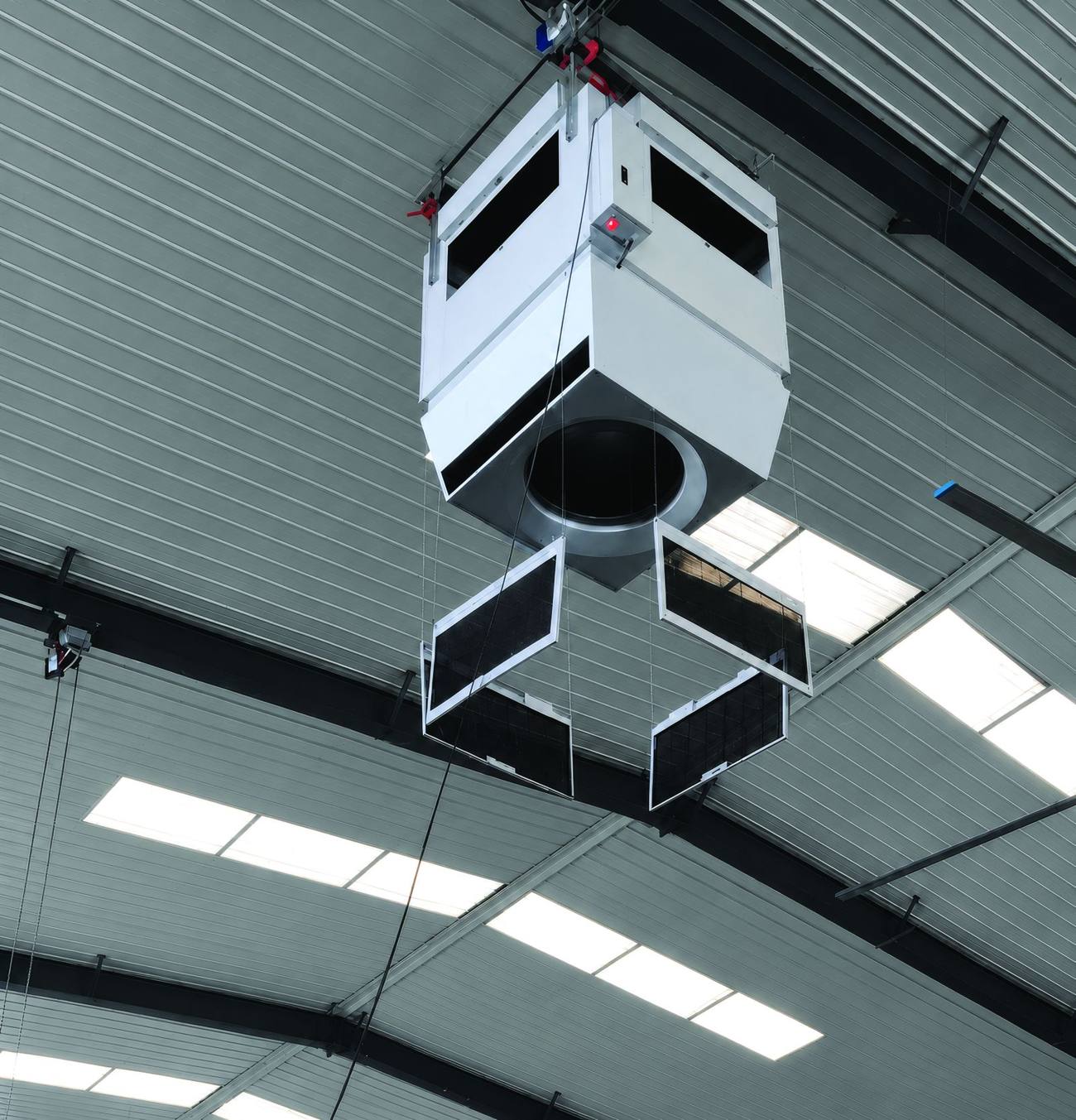 Automatic filter lowering on a Mycond OXA unit — filter cassettes lowered on cables for servicing from the floor