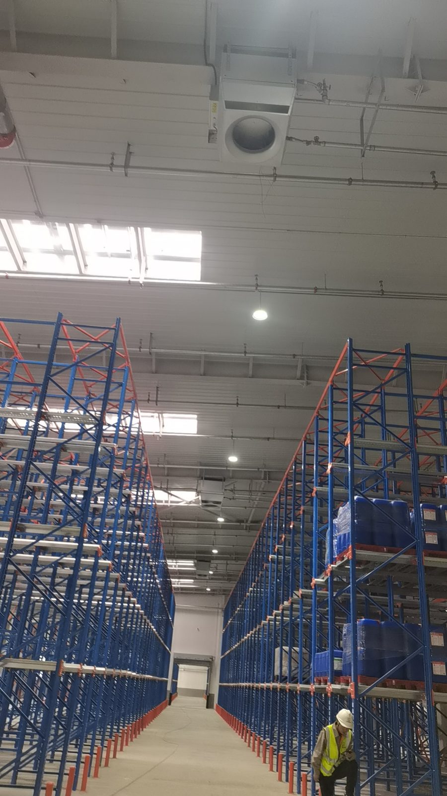 warehouse heating — Mycond OXA units above the racking in a logistics centre